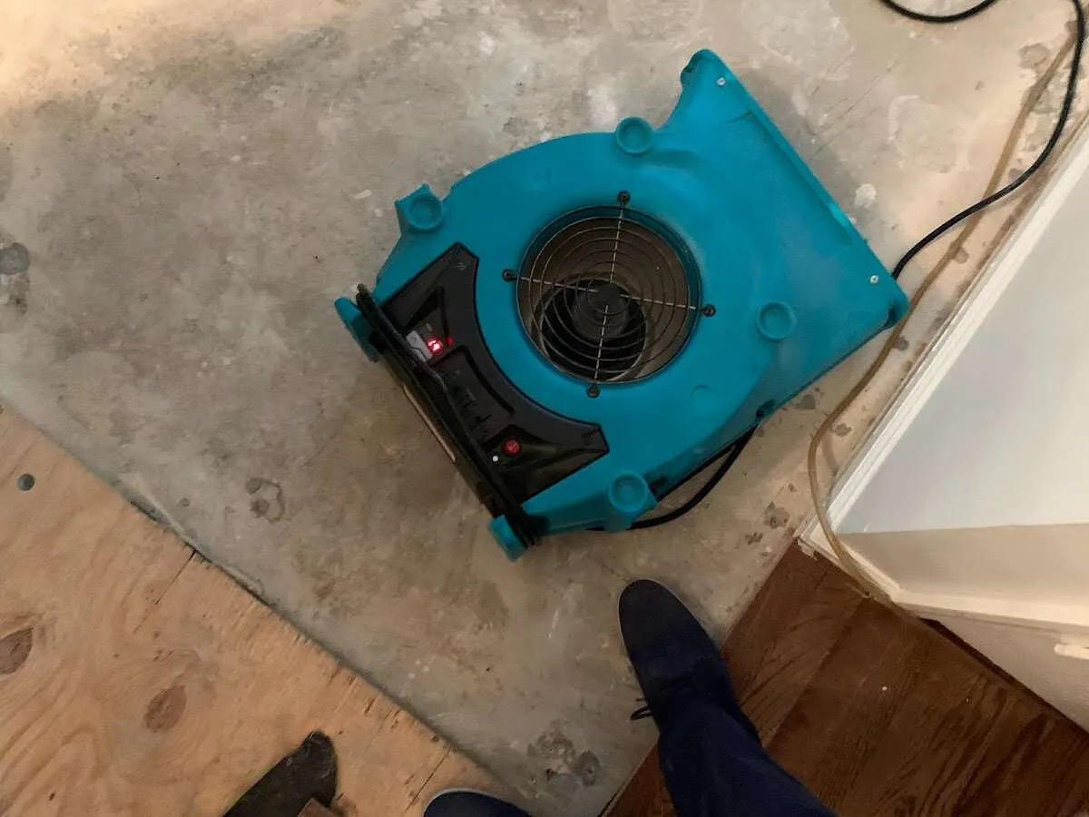 Air mover drying subfloor during Leak Detection & Repair in West Sacramento